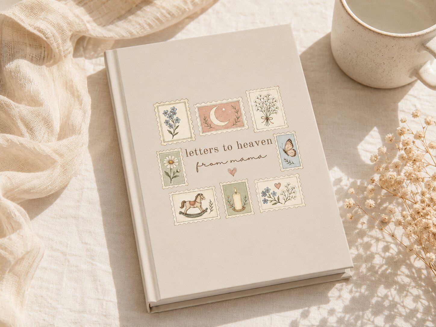 Letters to Heaven memorial journal beside a ceramic mug and dried flowers